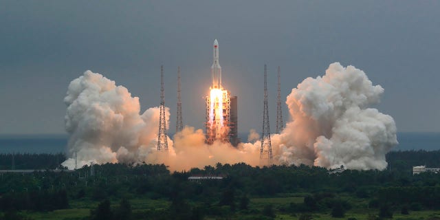 In this photo released by China's Xinhua News Agency, a Long March 5B rocket carrying a module for a Chinese space station lifts off from the Wenchang Spacecraft Launch Site in Wenchang in southern China's Hainan Province, Thursday, April 29, 2021. China has launched the core module on Thursday for its first permanent space station that will host astronauts long-term. (Ju Zhenhua/Xinhua via AP)