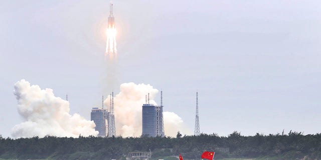 In this photo released by China's Xinhua News Agency, a Long March 5B rocket carrying a module for a Chinese space station lifts off from the Wenchang Spacecraft Launch Site in Wenchang in southern China's Hainan Province, Thursday, April 29, 2021. China has launched the core module on Thursday for its first permanent space station that will host astronauts long-term. (Jin Liwang/Xinhua via AP)