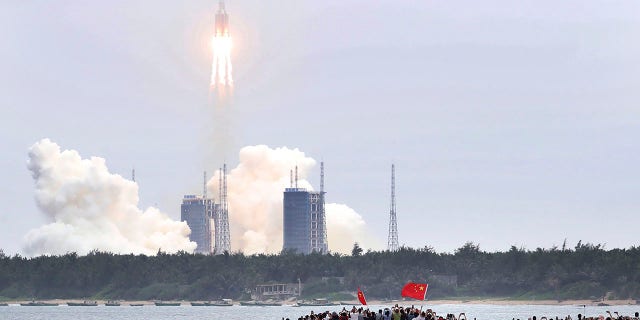 In this photo released by China's Xinhua News Agency, a Long March 5B rocket carrying a module for a Chinese space station lifts off from the Wenchang Spacecraft Launch Site in Wenchang in southern China's Hainan Province, Thursday, April 29, 2021. China has launched the core module on Thursday for its first permanent space station that will host astronauts long-term. (Jin Liwang/Xinhua via AP)