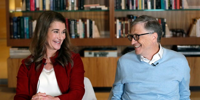 In this Feb. 1, 2019, file photo, Bill and Melinda Gates smile at each other during an interview in Kirkland, Wash.