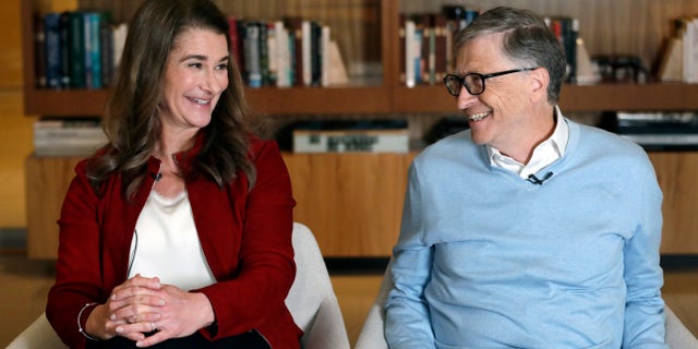 In this Feb. 1, 2019, file photo, Bill and Melinda Gates smile at each other during an interview in Kirkland, Wash.