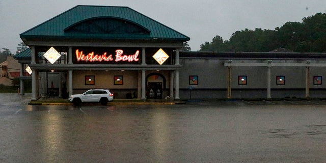 A parking lot is flooded as severe weather produces torrential rainfall, Tuesday, May 4, 2021 in Vestavia, Ala. (AP Photo/Butch Dill)