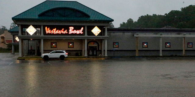 A parking lot is flooded as severe weather produces torrential rainfall, Tuesday, May 4, 2021 in Vestavia, Ala. (AP Photo/Butch Dill)