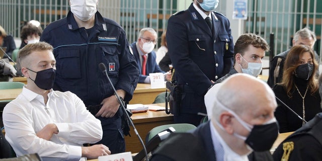 Finnegan Lee Elder, left, and co-defendant Gabriel Natale-Hjorth, right, sit Wednesday before a jury began deliberating their fate in the trial for the slaying of an Italian plainclothes police officer on a street near the hotel where they were staying while on vacation in Rome in summer 2019, in Rome. (AP Photo/Gregorio Borgia)