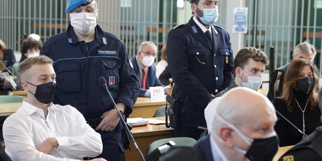 Finnegan Lee Elder, left, and co-defendant Gabriel Natale-Hjorth, right, sit Wednesday before a jury began deliberating their fate in the trial for the slaying of an Italian plainclothes police officer on a street near the hotel where they were staying while on vacation in Rome in summer 2019, in Rome. (AP Photo/Gregorio Borgia)
