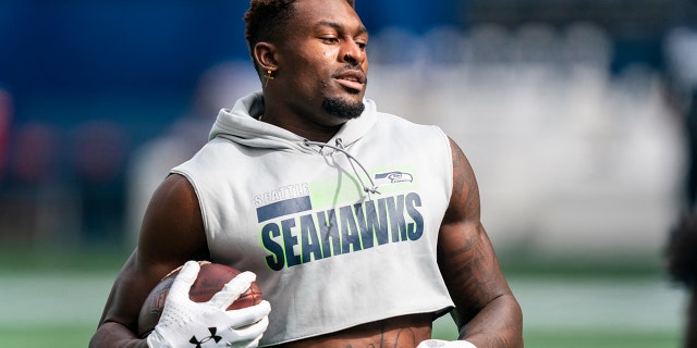 Seahawks wide receiver DK Metcalf runs with the ball during warmups before the Dallas Cowboys game in Seattle, Sept. 27, 2020. 