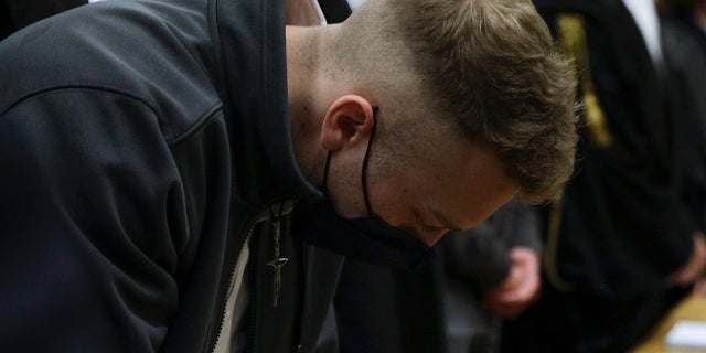 Finnegan Lee Elder listens to the verdict in the trial for the slaying of an Italian plainclothes police officer on a street near the hotel where he and his co-defendant Gabriel Natale-Hjorth were staying while on vacation in Rome in the summer of 2019. (AP Photo/Gregorio Borgia)