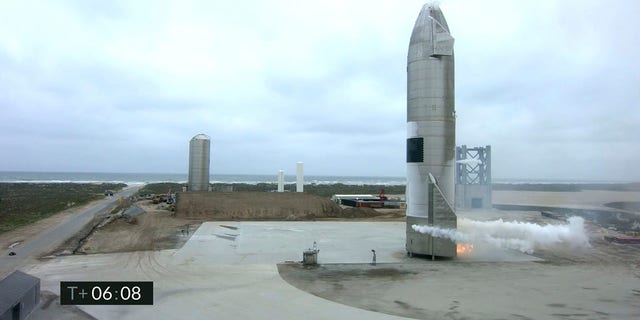 In this image from video made available by SpaceX, a Starship test vehicle sits on the ground after returning from a flight test in Boca Chica, Texas on Wednesday, May 5, 2021.