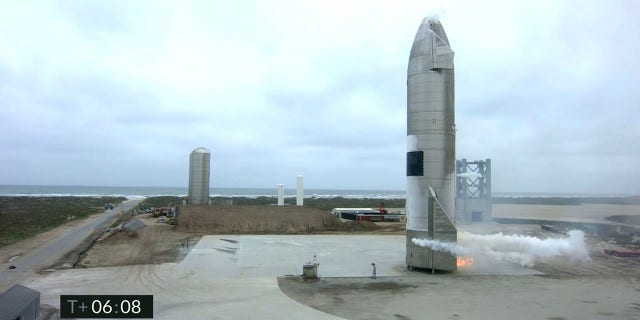 In this image from video made available by SpaceX, a Starship test vehicle sits on the ground after returning from a flight test in Boca Chica, Texas on Wednesday, May 5, 2021.