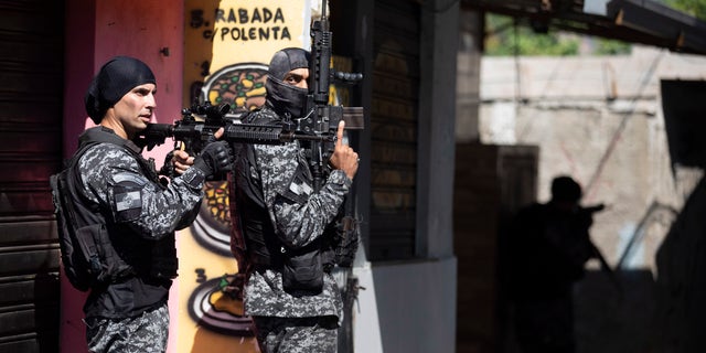 Police conduct an operation against alleged drug traffickers in the Jacarezinho favela of Rio de Janeiro, Brazil, Thursday, May 6, 2021. (AP Photo/Silvia Izquierdo)