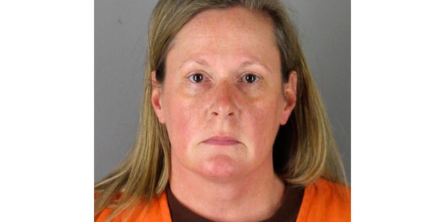 This undated booking photo released by the Hennepin County, Minn., sheriff shows Kim Potter, a former Brooklyn Center, Minn., police officer. She is expected to testify on her own behalf Friday while on trial for manslaughter charges in the death of Daunte Wright. (Hennepin County Sheriff via AP)
