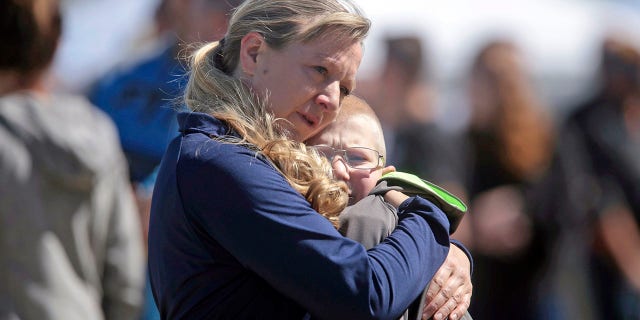 People embrace after a school shooting at Rigby Middle School in Rigby, Idaho, on Thursday. (John Roark/The Idaho Post-Register via AP)