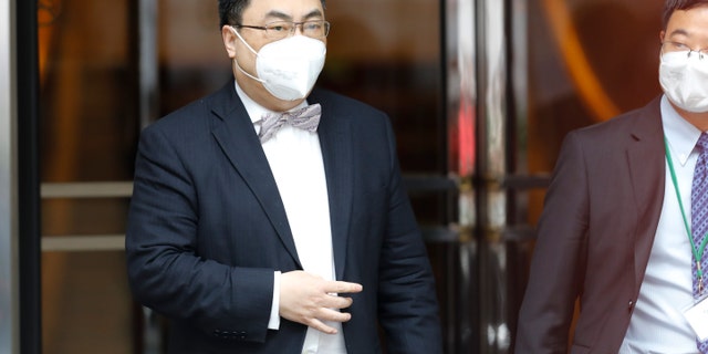 The ambassador of the Permanent Mission of the People's Republic of China to the United Nations, Wang Qun, leaves the Grand Hotel Wien, where closed-door nuclear talks with Iran take place in Vienna, Austria, Friday, May 7, 2021. (AP Photo/Lisa Leutner)