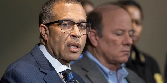 FILE - In this Nov. 21, 2019, file photo, Detroit Police Chief James Craig, left, speaks to the media at Detroit Public Safety Headquarters in Detroit.