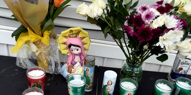 A memorial is seen on Monday outside a mobile home in Colorado Springs, Colo., where a shooting at a party took place a day earlier that killed six people before the gunman took his own life. (AP Photo/Thomas Peipert)