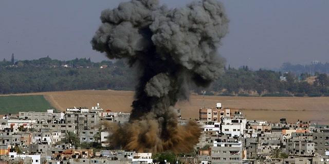 Smoke rises after an Israeli airstrike in Gaza City, Tuesday, May 11, 2021. (AP Photo/Hatem Moussa)