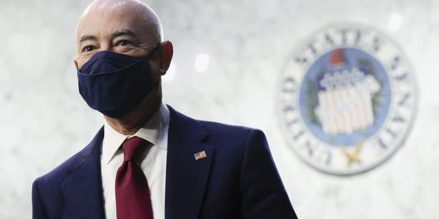Homeland Security Secretary Alejandro Mayorkas looks on during a break in a Senate Appropriations committee hearing to examine domestic extremism, Wednesday, May 12, 2021 on Capitol Hill in Washington. (Alex Wong/Pool via AP)