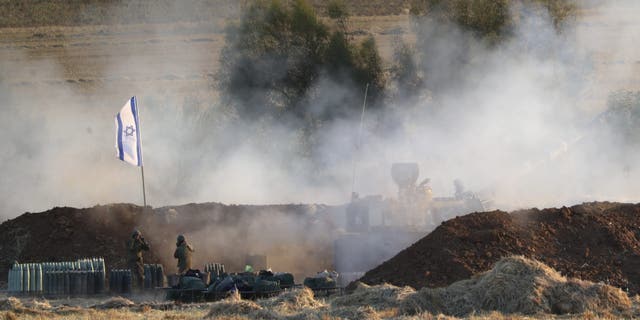 An Israeli artillery unit fires at targets in the Gaza Strip at the Israeli Gaza border on Thursday, May 13, 2021 (AP Photo / Ariel Schalit)