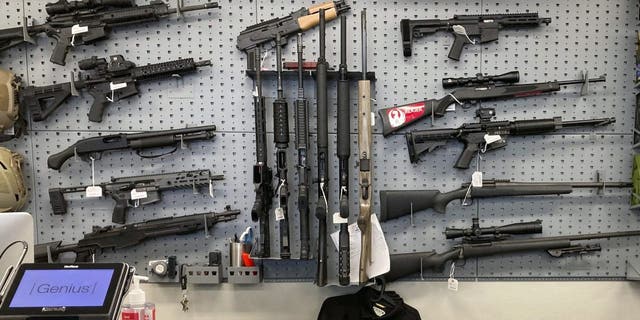 In this Feb. 19, 2021, file photo, firearms are displayed at a gun shop in Salem, Oregon.