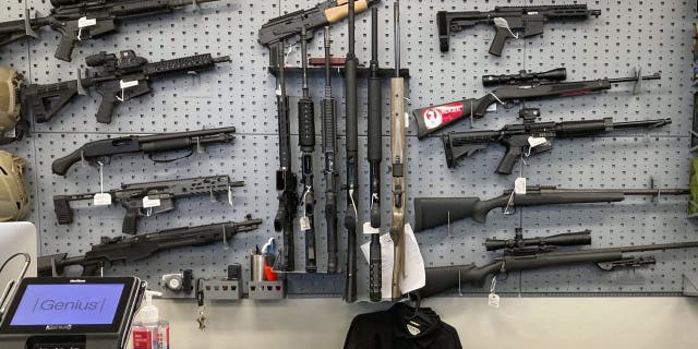 In this Feb. 19, 2021, file photo, firearms are displayed at a gun shop in Salem, Oregon.