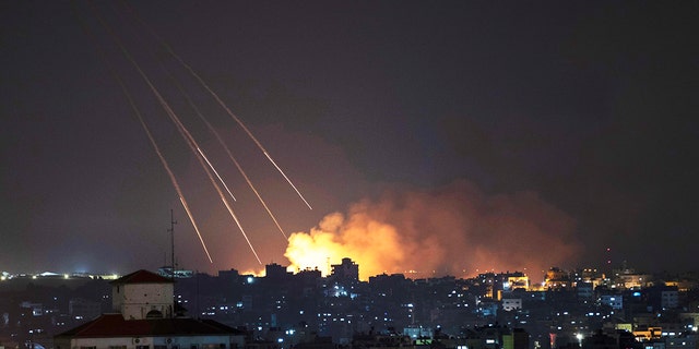 Smoke rises following Israeli missile strikes on Gaza City, May 13, 2021.