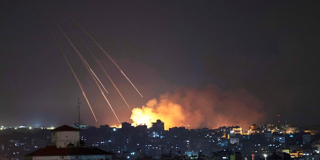 Smoke rises following Israeli missile strikes on Gaza City, May 13, 2021.