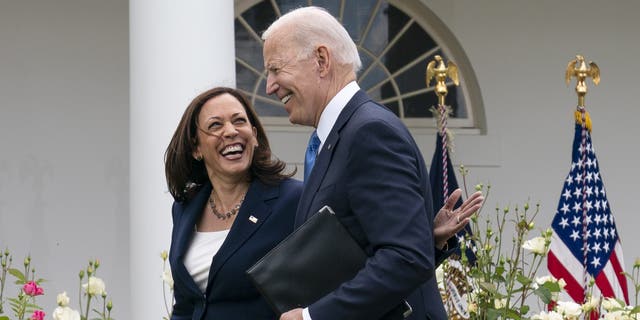 Vice President Kamala Harris and President Joe Biden after speaking about updated guidance on mask mandates, in the Rose Garden of the White House, Thursday, May 13, 2021, in Washington. (AP Photo/Evan Vucci)