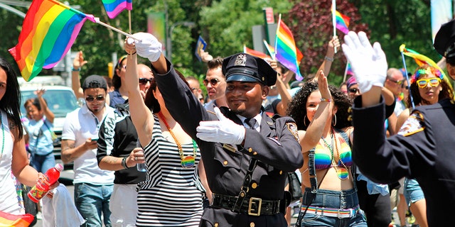 NYPD police officers march along Fifth Avenue during the gay pride parade in New York City, June 29, 2014. (Associated Press)