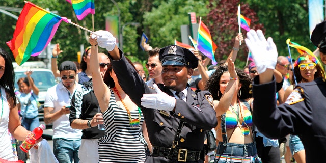 NYPD police officers march along Fifth Avenue during the gay pride parade in New York City, June 29, 2014. (Associated Press)