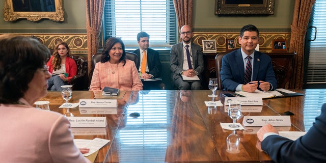 Clockwise from left, Rep. Norma Torres, D-Calif., Rep. Lucille Roybal-Allard, D-Calif., Congressional Hispanic Caucus (CHC) Chair Rep. Raul Ruiz, D-Calif., and Rep. Albio Sires, D- N.J., attend a meeting with Vice President Kamala Harris with the CHC, in her ceremonial office, Monday, May 17, 2021, on the White House complex in Washington. (AP Photo/Jacquelyn Martin)