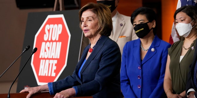 House Speaker Nancy Pelosi of Calif., left, speaks during a news conference on Capitol Hill in Washington, Tuesday, May 18, 2021, on the COVID-19 Hate Crimes Act. Pelosi is joined by Rep. Mark Takano, D-Calif., second from left, Rep. Judy Chu, D-Calif., second from right and Rep. Grace Meng, D-N.Y. (AP Photo/Susan Walsh)