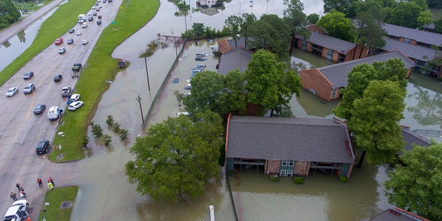 An aerial view of the flooded Siegen Calais apartments Tuesday, May 18, 2021, in Baton Rouge, La. Heavy rains have swept across southern Louisiana, flooding homes, swamping cars and closing a major interstate. (John Ballance/The Advocate via AP)