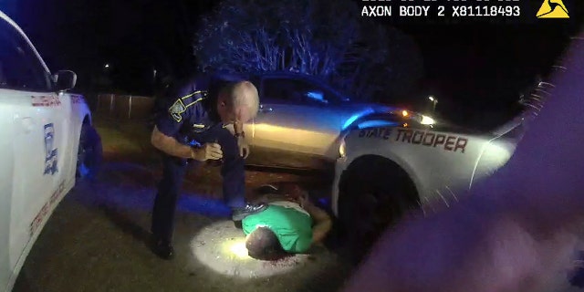 Louisiana State Police stand over Ronald Greene