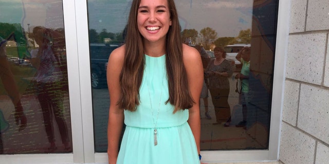 In this September 2016 file photo provided by Kim Calderwood, Mollie Tibbetts poses for a picture during homecoming festivities at BGM High School in her hometown of Brooklyn, Iowa. (Kim Calderwood via AP, File)