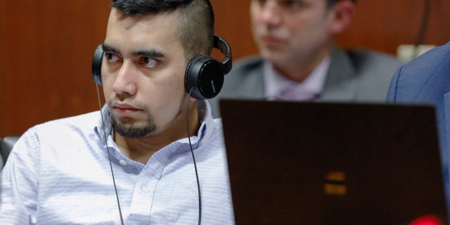 Cristhian Bahena Rivera listens to testimony that has been translated into Spanish by an interpreter during his trial at the Scott County Courthouse in Davenport, Iowa. (Jim Slosiarek/The Gazette via AP, Pool)