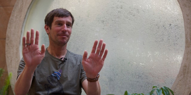 Mountain guide Lukas Furtenbach speaks to The Associated Press in Kathmandu, Nepal, Saturday, May 22, 2021. Furtenbach, an expert climbing guide said Saturday that a coronavirus outbreak on Mount Everest has infected at least 100 climbers and support staff, giving the first comprehensive estimate amid official Nepalese denials of a COVID-19 cluster on the world’s highest peak. (AP Photo/Bikram Rai)