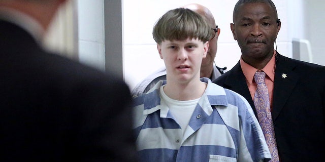 In this April 10, 2017, file photo, Dylann Roof enters the courtroom at the Charleston County Judicial Center in Charleston, S.C. On Tuesday, May 25, 2021,  (Grace Beahm/The Post And Courier via AP, Pool, File)