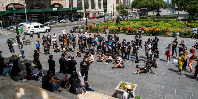 People attend a rally with Terrence Floyd, brother of George Floyd, on Sunday, May 23, 2021, in Brooklyn borough of New York. (AP Photo/Eduardo Munoz Alvarez)