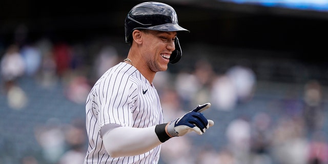 New York Yankees designated hitter Aaron Judge reacts after drawing a base-loaded walk for the winning run against the Chicago White Sox on May 23, 2021 at Yankee Stadium in New York City. 