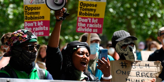 FILE - In this Saturday, June 13, 2020 file photo Sasha Johnson, center, of the Black Lives Matter movement attends a protest at Hyde Park in London. Johnson, a British Black Lives Matter campaigner is in a critical condition after sustaining a gunshot wound to her head, a statement from her political party, Taking the Initiative Party, has said. (AP Photo/Alberto Pezzali, File)