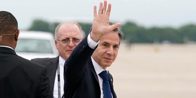 Secretary of State Antony Blinken waves as he departs, Monday, May 24, 2021, at Andrews Air Force Base, Md. Blinken said Tuesday that the United States will continue its effort to rejoin the Iran nuclear deal over Israeli objections. (AP Photo/Alex Brandon, Pool)