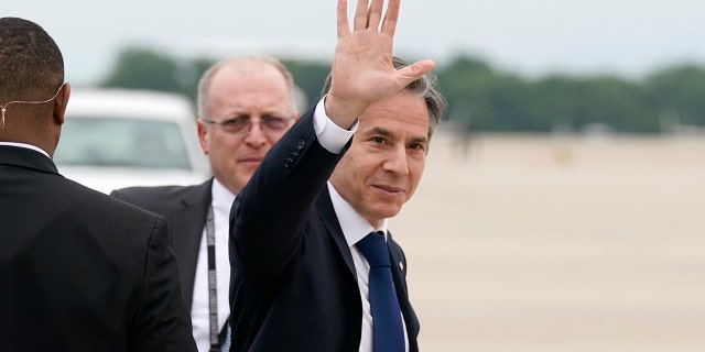 Secretary of State Antony Blinken waves as he departs, Monday, May 24, 2021, at Andrews Air Force Base, Md. Blinken said Tuesday that the United States will continue its effort to rejoin the Iran nuclear deal over Israeli objections. (AP Photo/Alex Brandon, Pool)