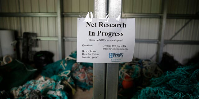 Ghost nets and other debris sit in a shed at Hawaii Pacific University's Center for Marine Debris Research on Wednesday, May 12, 2021, in Kaneohe, Hawaii. Researchers are conducting a study that is attempting to trace derelict fishing gear that washes ashore in Hawaii back to the manufacturers and fisheries that it came from. (AP Photo/Caleb Jones)