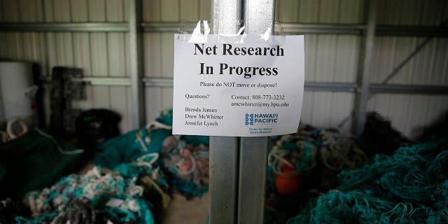 Ghost nets and other debris sit in a shed at Hawaii Pacific University's Center for Marine Debris Research on Wednesday, May 12, 2021, in Kaneohe, Hawaii. Researchers are conducting a study that is attempting to trace derelict fishing gear that washes ashore in Hawaii back to the manufacturers and fisheries that it came from. (AP Photo/Caleb Jones)