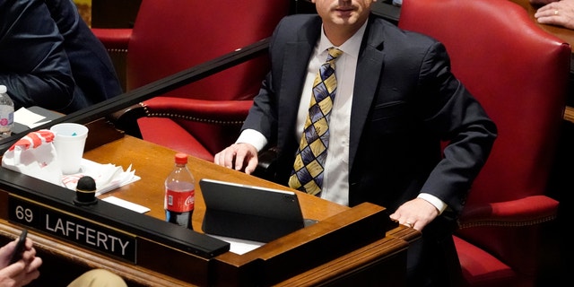 FILE - In this May 4, 2021, file photo, State Rep. Justin Lafferty, R-Knoxville, watches the tally board during a vote in the House of Representatives in Nashville, Tenn. Lafferty falsely declared that an original constitutional provision designating a slave as three-fifths of a person was adopted for "the purpose of ending slavery," commenting amid a debate over whether educators should be restricted while teaching about systematic racism in America. (AP Photo/Mark Humphrey, File)