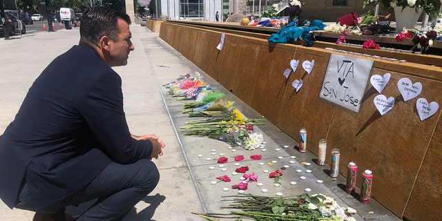 San Jose Mayor Sam Liccardo stops to view a makeshift memorial for the rail yard shooting victims in front of City Hall in San Jose, Calif., on Thursday, May 27, 2021. (Associated Press)