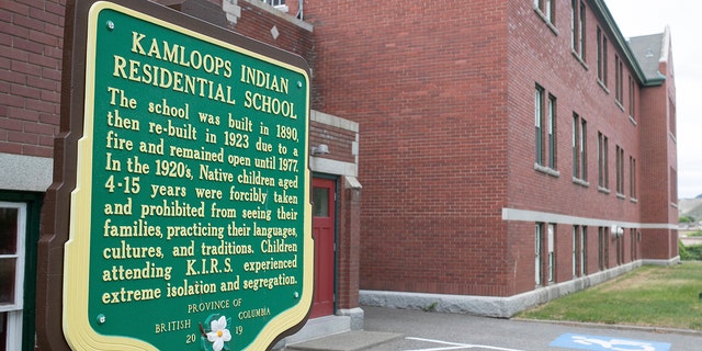 A plaque is seen outside of the former Kamloops Indian Residential School on Tk'emlups te Secwépemc First Nation in Kamloops, British Columbia, Canada on Thursday, May 27, 2021. The remains of 215 children have been found buried on the site of the former residential school in Kamloops.  (Associated Press)