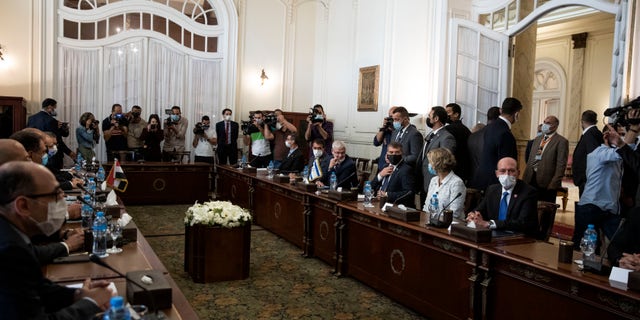 Israeli Foreign Minister Gabi Ashkenazi, third right, with Egyptian Foreign Minister Sameh Shoukry (not shown), during high-level talks to shore up a fragile truce between Israel and the Hamas militant group at the Tahrir Palace in Cairo, Egypt, Sunday, May 30, 2021. (AP Photo/Nariman El-Mofty)