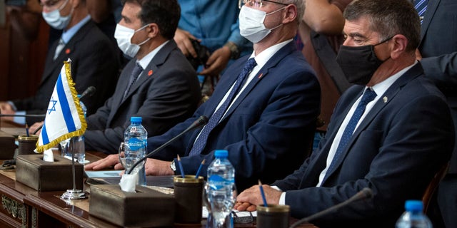 Israeli Foreign Minister Gabi Ashkenazi, right, meets with Egyptian Foreign Minister Sameh Shoukry (not shown), during high-level talks to shore up a fragile truce between Israel and the Hamas militant group at the Tahrir Palace in Cairo, Egypt, Sunday, May 30, 2021. (AP Photo/Nariman El-Mofty)