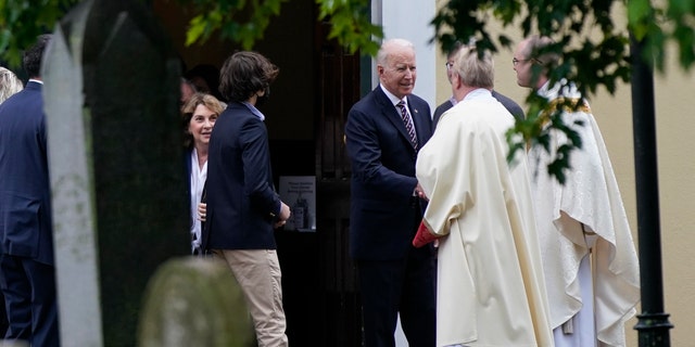 President Joe Biden speaks with priests as he departs after attending Mass at St. Joseph on the Brandywine Catholic Church, Sunday, May 30, 2021, in Wilmington, Del. (AP Photo/Patrick Semansky)